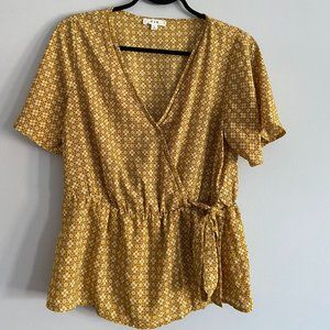New never worn yellow flowy blouse. Size L.